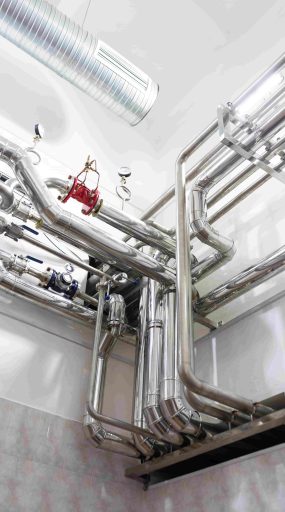steel-pipelines-cables-factory-interior-as-industrial-zone-background-concept-min-scaled.jpg
